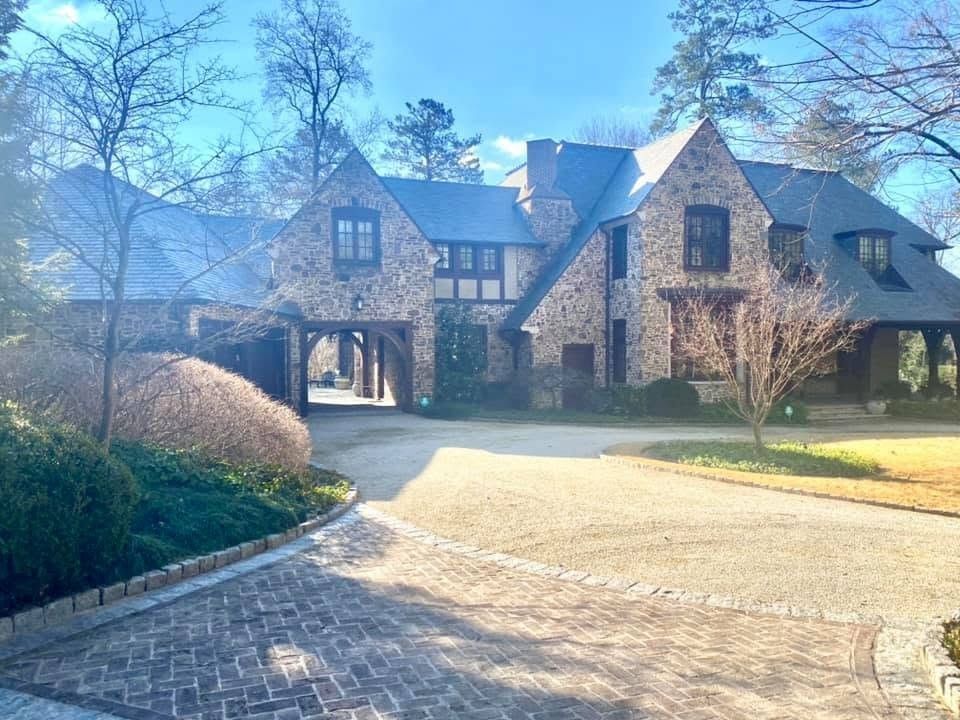 Stone Tudor-style estate home on a horse farm in Atlanta
